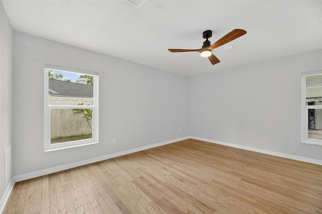 12331 Yellow Rose Cir, Riverview, FL 33569 - empty room featuring light wood-style flooring and ceiling fan