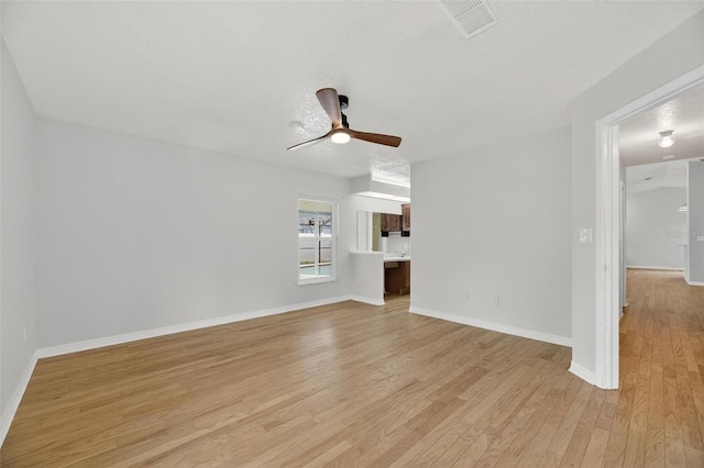 12331 Yellow Rose Cir, Riverview, FL 33569 - unfurnished living room featuring a ceiling fan and light wood-style flooring