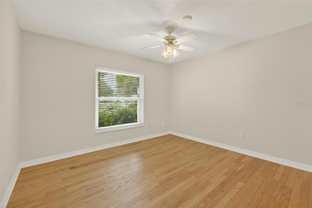 12331 Yellow Rose Cir, Riverview, FL 33569 - unfurnished room featuring light wood-style flooring, a smoke detector, ceiling fan, and a textured ceiling