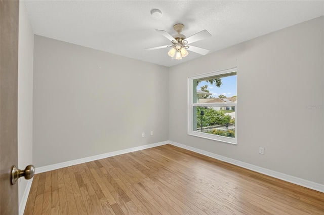12331 Yellow Rose Cir, Riverview, FL 33569 - spare room featuring light wood finished floors and a ceiling fan