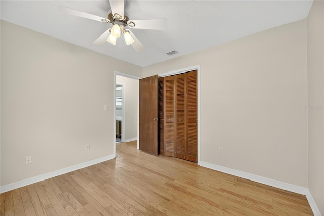 12331 Yellow Rose Cir, Riverview, FL 33569 - unfurnished bedroom featuring light wood-style floors, a closet, and ceiling fan