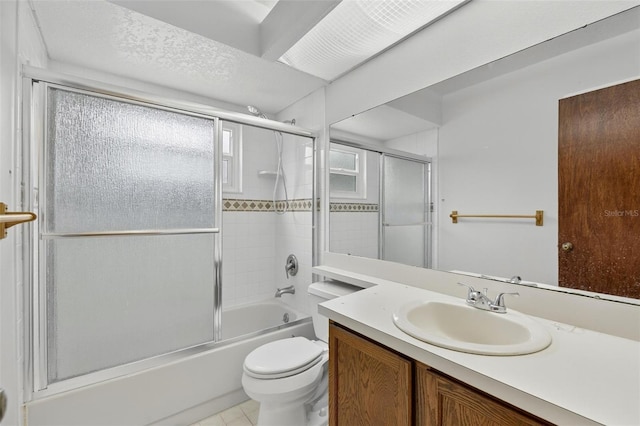 12331 Yellow Rose Cir, Riverview, FL 33569 - bathroom featuring vanity, combined bath / shower with glass door, and tile patterned flooring