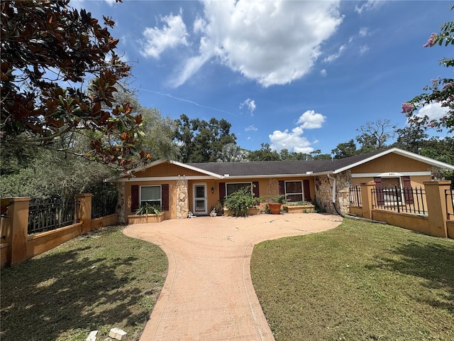 3411 Holland Dr, Brandon, FL 33511 - single story home with stone siding and concrete driveway