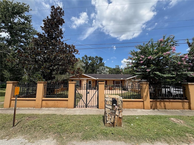 3411 Holland Dr, Brandon, FL 33511 - view of front facade featuring a fenced front yard