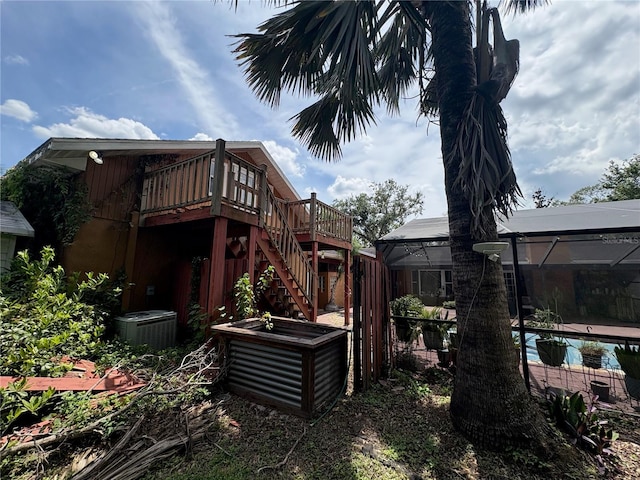 3411 Holland Dr, Brandon, FL 33511 - view of yard with a wooden deck, an outdoor pool, stairway, and a lanai