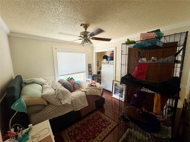 3411 Holland Dr, Brandon, FL 33511 - bedroom with crown molding, wood finished floors, a textured ceiling, and a ceiling fan