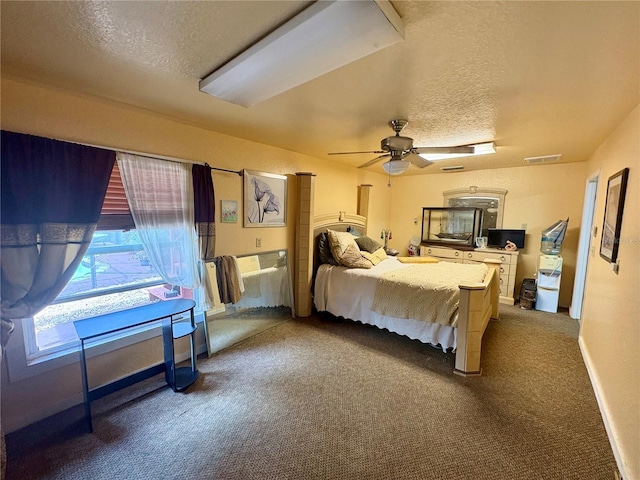 3411 Holland Dr, Brandon, FL 33511 - bedroom with dark carpet, a textured ceiling, and a ceiling fan