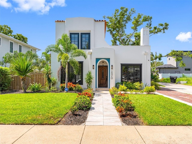 1570 48th Ave N, Saint Petersburg, FL 33703 - mediterranean / spanish house featuring stucco siding and a chimney