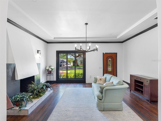1570 48th Ave N, Saint Petersburg, FL 33703 - living room with a tray ceiling, wood finished floors, a chandelier, and ornamental molding