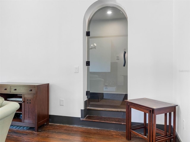 1570 48th Ave N, Saint Petersburg, FL 33703 - hallway with dark wood-style floors and arched walkways