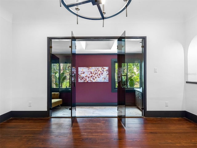 1570 48th Ave N, Saint Petersburg, FL 33703 - entryway with healthy amount of natural light and wood finished floors