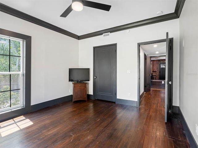 1570 48th Ave N, Saint Petersburg, FL 33703 - empty room featuring crown molding, dark wood-style floors, and a ceiling fan
