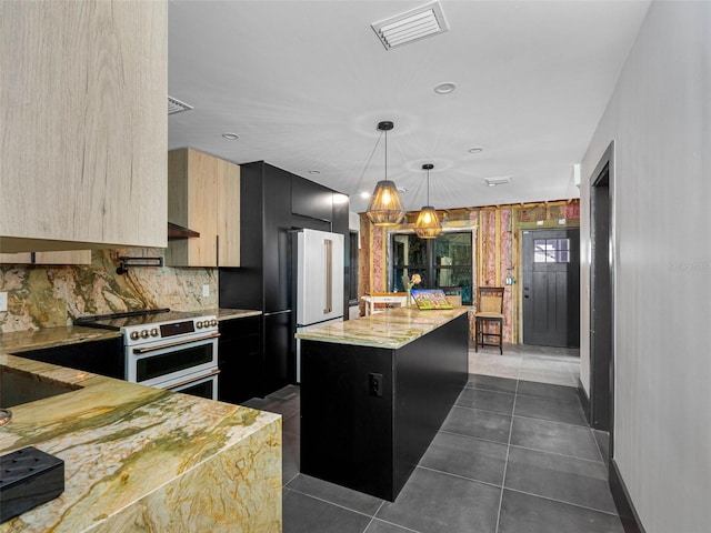 1570 48th Ave N, Saint Petersburg, FL 33703 - kitchen featuring modern cabinets, double oven range, a kitchen island, backsplash, and dark cabinetry