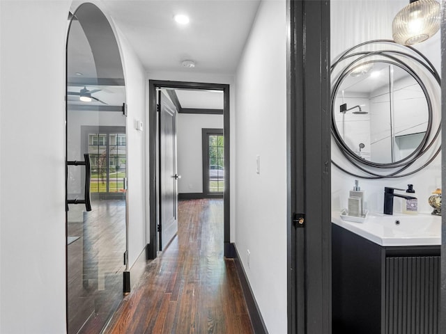 1570 48th Ave N, Saint Petersburg, FL 33703 - corridor with dark wood-style floors and baseboards