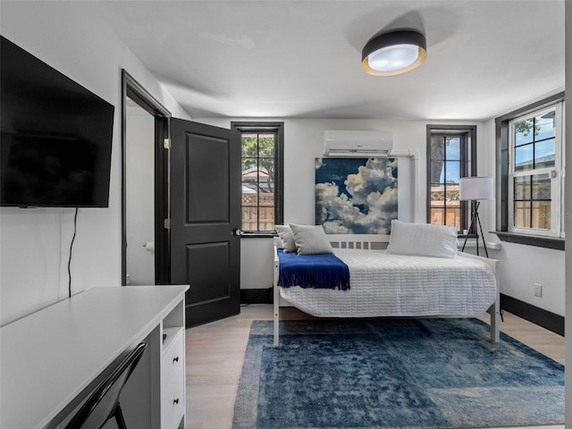 1570 48th Ave N, Saint Petersburg, FL 33703 - bedroom featuring light wood-style flooring and multiple windows