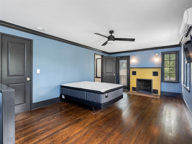1570 48th Ave N, Saint Petersburg, FL 33703 - bedroom with wood finished floors, crown molding, an AC wall unit, ceiling fan, and a fireplace with flush hearth