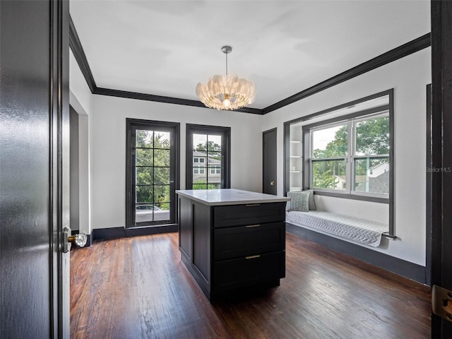 1570 48th Ave N, Saint Petersburg, FL 33703 - kitchen featuring dark cabinetry, ornamental molding, light countertops, a chandelier, and dark wood finished floors