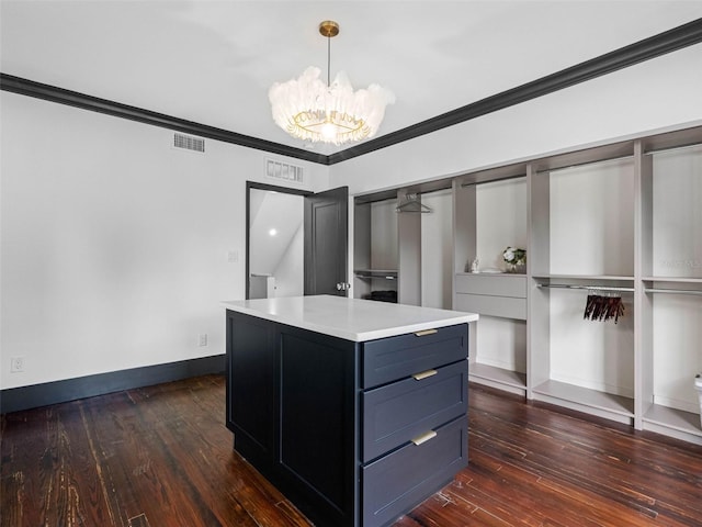 1570 48th Ave N, Saint Petersburg, FL 33703 - spacious closet with dark wood-style floors and a chandelier