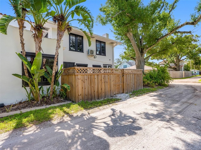 1570 48th Ave N, Saint Petersburg, FL 33703 - view of front facade with stucco siding and a chimney