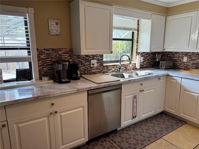 6801 34th Ave W, Bradenton, FL 34209 - kitchen featuring dishwasher, decorative backsplash, white cabinets, light countertops, and ornamental molding
