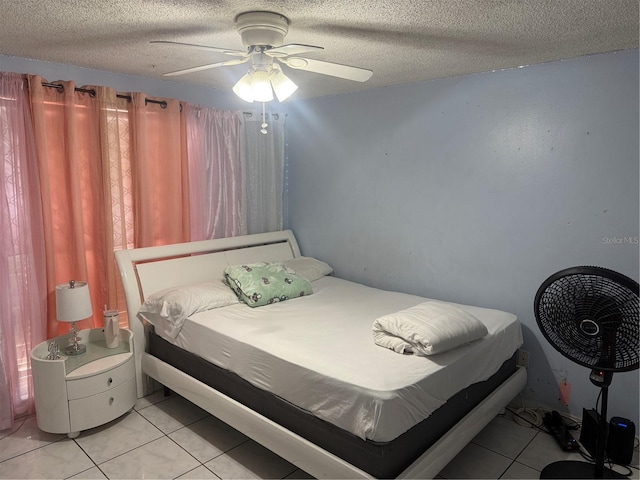 9705 Kingsburgh Ct, Tampa, FL 33615 - bedroom with light tile patterned flooring, a textured ceiling, and ceiling fan