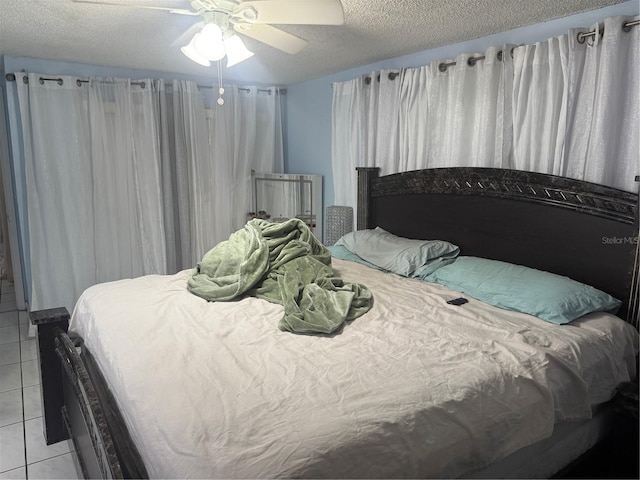 9705 Kingsburgh Ct, Tampa, FL 33615 - bedroom with light tile patterned flooring, a textured ceiling, and ceiling fan