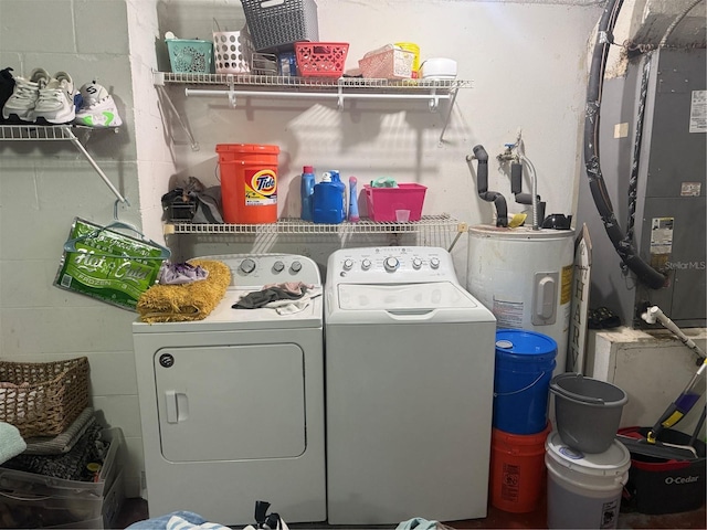 9705 Kingsburgh Ct, Tampa, FL 33615 - washroom featuring independent washer and dryer, water heater, concrete block wall, and heating unit