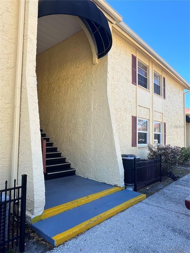 7518 Dolonita Dr Unit 7518, Tampa, FL 33615 - view of property exterior with stucco siding