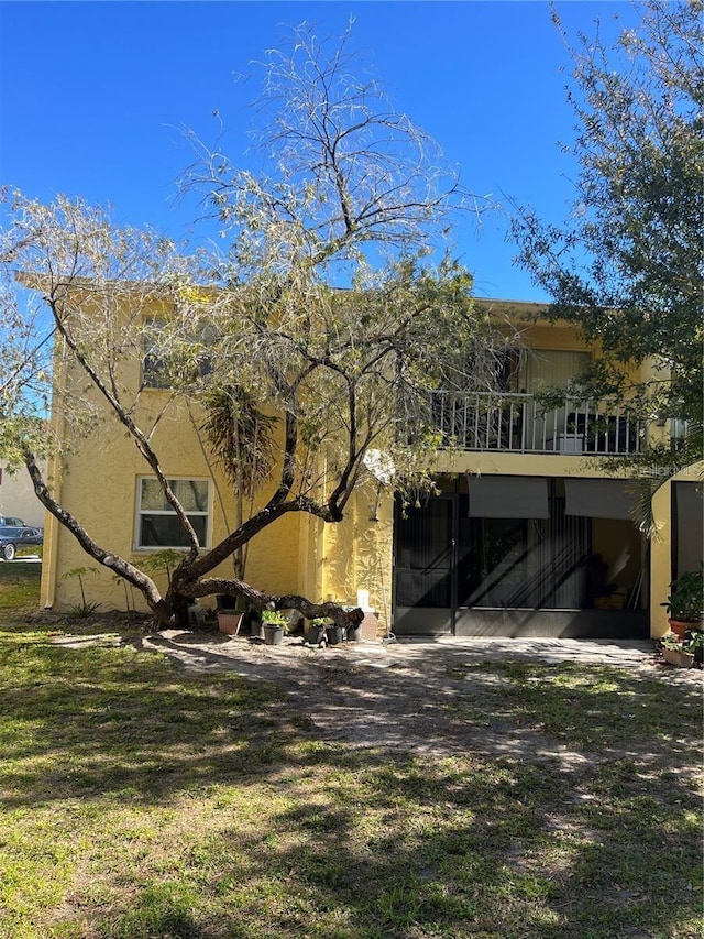 7518 Dolonita Dr Unit 7518, Tampa, FL 33615 - rear view of house featuring a balcony and stucco siding