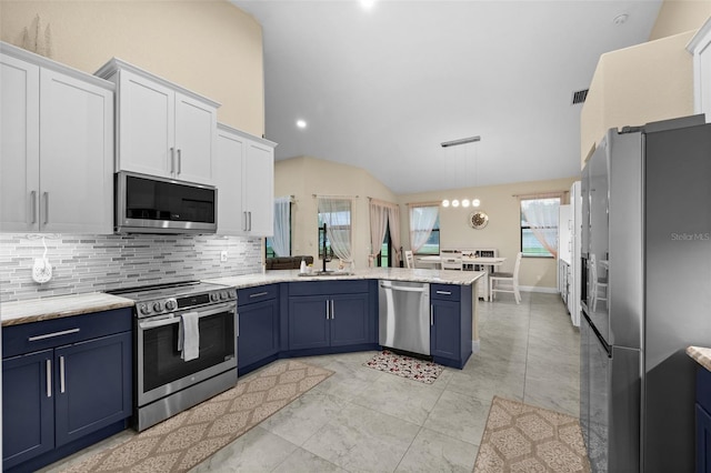 13395 59th Ct N, West Palm Beach, FL 33411 - kitchen with stainless steel appliances, blue cabinetry, a peninsula, lofted ceiling, and recessed lighting