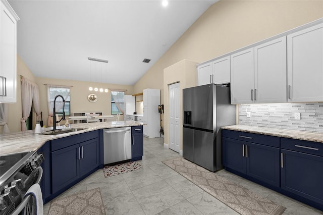 13395 59th Ct N, West Palm Beach, FL 33411 - kitchen featuring appliances with stainless steel finishes, blue cabinets, backsplash, white cabinets, and high vaulted ceiling
