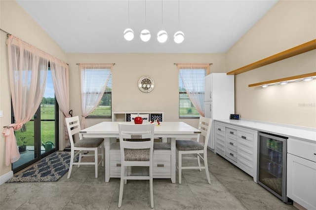 13395 59th Ct N, West Palm Beach, FL 33411 - dining room featuring wine cooler, plenty of natural light, and lofted ceiling
