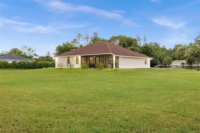13395 59th Ct N, West Palm Beach, FL 33411 - view of front of house with a front lawn and a sunroom