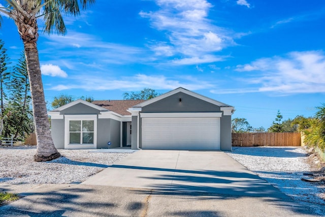 5682 25th Street Cir E, Bradenton, FL 34203 - single story home with stucco siding, an attached garage, and driveway