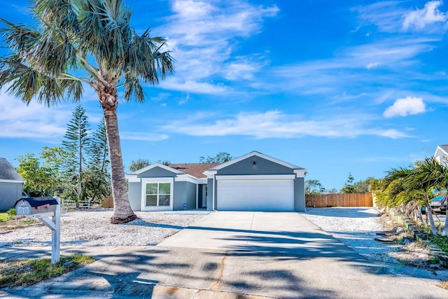 5682 25th Street Cir E, Bradenton, FL 34203 - ranch-style house with an attached garage, concrete driveway, and stucco siding
