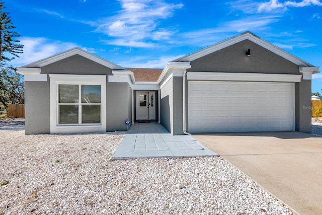5682 25th Street Cir E, Bradenton, FL 34203 - single story home featuring stucco siding, an attached garage, and concrete driveway