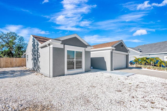 5682 25th Street Cir E, Bradenton, FL 34203 - ranch-style home featuring stucco siding and a garage