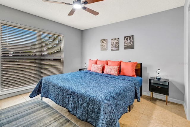 5682 25th Street Cir E, Bradenton, FL 34203 - tiled bedroom with a textured ceiling and ceiling fan