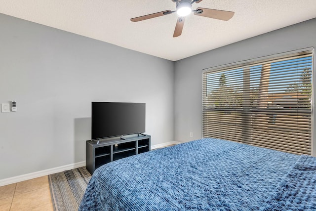 5682 25th Street Cir E, Bradenton, FL 34203 - bedroom featuring a textured ceiling, tile patterned flooring, and ceiling fan