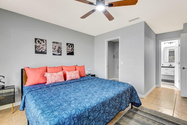 5682 25th Street Cir E, Bradenton, FL 34203 - tiled bedroom with ceiling fan and a walk in closet