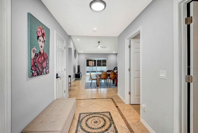 5682 25th Street Cir E, Bradenton, FL 34203 - hallway with light tile patterned floors and inlaid floor details