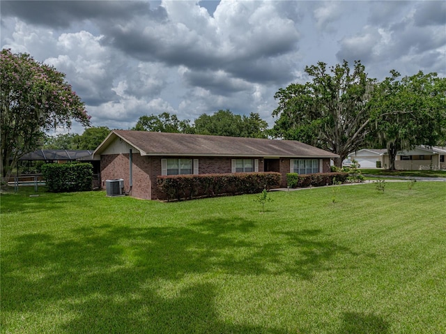 609 W Pipkin Rd, Lakeland, FL 33813 - ranch-style house with brick siding and a front yard