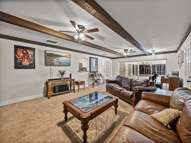 609 W Pipkin Rd, Lakeland, FL 33813 - carpeted living area with ceiling fan, beamed ceiling, and a textured ceiling