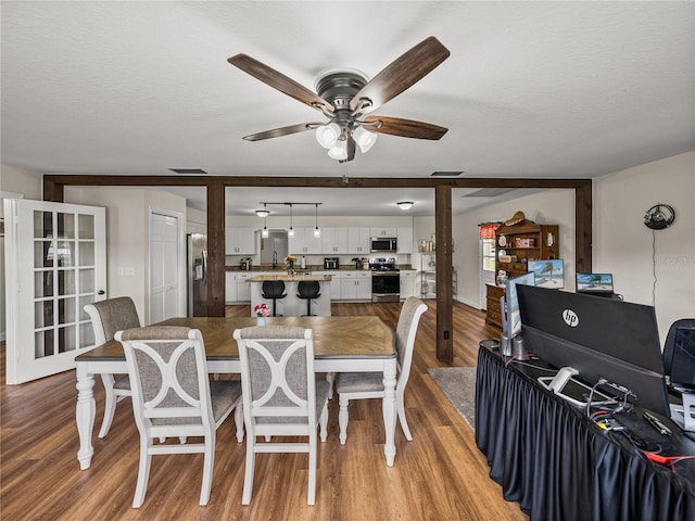 609 W Pipkin Rd, Lakeland, FL 33813 - dining area featuring a ceiling fan, light wood-style floors, and a textured ceiling