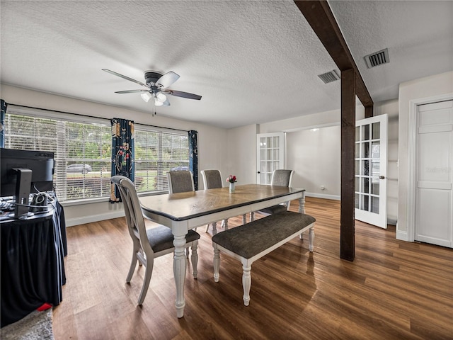 609 W Pipkin Rd, Lakeland, FL 33813 - dining space featuring a textured ceiling, wood finished floors, and a ceiling fan