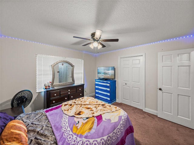 609 W Pipkin Rd, Lakeland, FL 33813 - carpeted bedroom with a closet, a textured ceiling, and ceiling fan