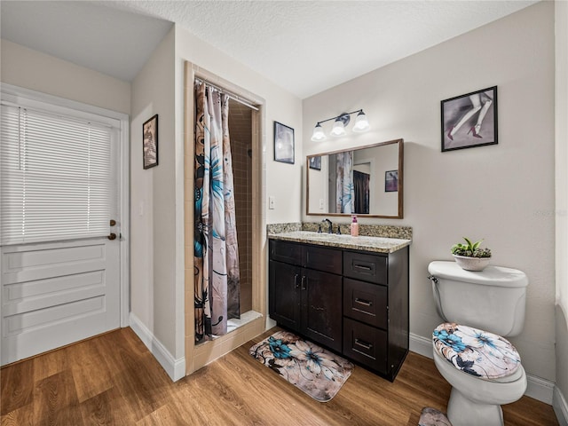 609 W Pipkin Rd, Lakeland, FL 33813 - bathroom with vanity, a stall shower, and wood finished floors