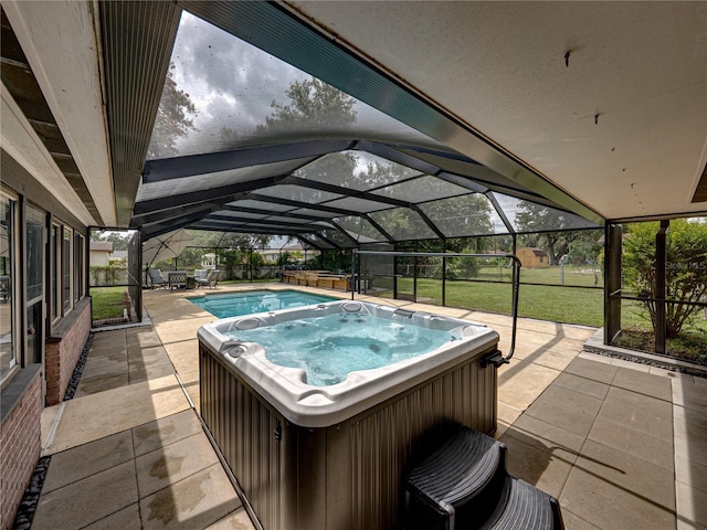 609 W Pipkin Rd, Lakeland, FL 33813 - view of swimming pool with a hot tub, a patio, and glass enclosure
