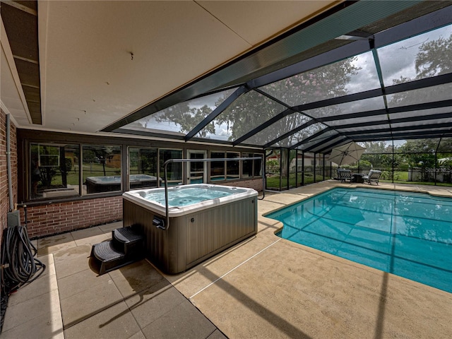 609 W Pipkin Rd, Lakeland, FL 33813 - view of pool with a hot tub, a patio area, and a lanai