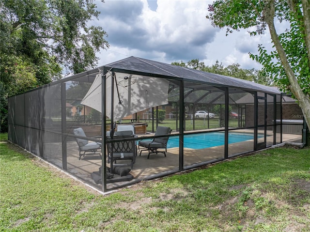 609 W Pipkin Rd, Lakeland, FL 33813 - swimming pool with a yard, a patio area, and glass enclosure